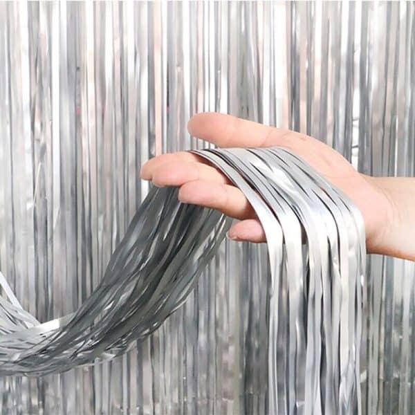 Silver foil curtain backdrop for birthday and party decoration with metallic fringe design