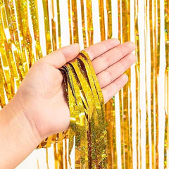 Golden foil curtain backdrop for birthday and party decoration with metallic fringe design